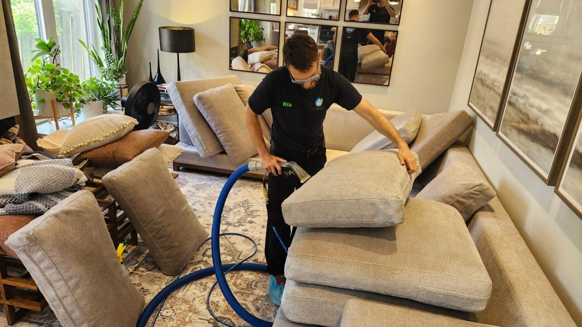 Our technitian cleaning one of the couch's cushions