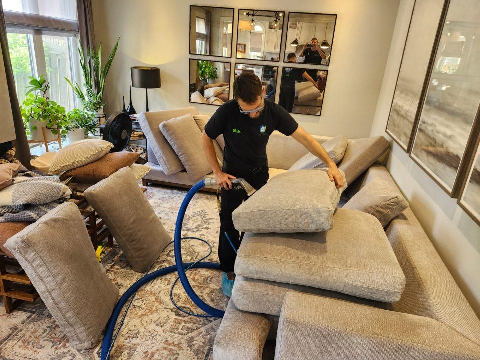 Our technitian cleaning one of the couch's cushions